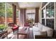 Cozy screened porch with comfortable seating, perfect for relaxing and enjoying the outdoors at 7994 Larksview Dr, Fairburn, GA 30213