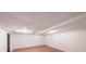 Unfinished basement featuring neutral walls, carpet flooring, and an exposed ceiling at 900 Mill Stone Dr, Marietta, GA 30062