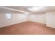 A finished basement with carpet and a window at 900 Mill Stone Dr, Marietta, GA 30062