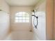 Bathroom featuring a shower, tiled walls, a frosted window, and vinyl floors at 900 Mill Stone Dr, Marietta, GA 30062