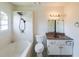 Bathroom featuring a shower, vanity with sink, tiled walls, and vinyl floors at 900 Mill Stone Dr, Marietta, GA 30062