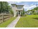 Inviting two-story home featuring well-manicured lawn and beautiful landscaping in a suburban neighborhood at 900 Mill Stone Dr, Marietta, GA 30062
