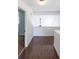 Well-lit hallway with hardwood floors, leading to various rooms in the home at 900 Mill Stone Dr, Marietta, GA 30062