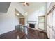 Bright living room with vaulted ceilings, a fireplace, large windows, and gleaming hardwood floors at 900 Mill Stone Dr, Marietta, GA 30062