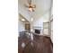 Spacious living room with a vaulted ceiling, modern fan, fireplace, and hardwood flooring for a warm ambiance at 900 Mill Stone Dr, Marietta, GA 30062