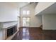 Sun-filled living room with hardwood floors, fireplace, and tall ceilings, showcasing modern elegance and comfort at 900 Mill Stone Dr, Marietta, GA 30062