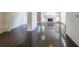 Open-concept living space featuring gleaming hardwood floors and a cozy fireplace with abundant natural light at 900 Mill Stone Dr, Marietta, GA 30062