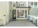 Back deck with a view into the home and a glass door at 900 Mill Stone Dr, Marietta, GA 30062