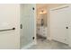 Modern bathroom features glass shower with white subway tile, granite vanity, and ceramic tile flooring at 1056 Riverstone Dr, Social Circle, GA 30025