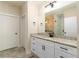 Bathroom featuring dual sinks, granite countertops, and a walk-in shower at 1056 Riverstone Dr, Social Circle, GA 30025