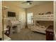 Bedroom featuring ceiling fan, television, bunkbeds, desk and shelving at 1056 Riverstone Dr, Social Circle, GA 30025