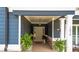 Charming entryway with an elegant white door, complemented by decorative plants and neutral accents at 1056 Riverstone Dr, Social Circle, GA 30025