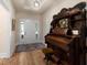 Inviting foyer with hardwood floors, unique furniture, and a welcoming atmosphere leading into the home at 1056 Riverstone Dr, Social Circle, GA 30025