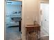 Hallway view leading to bedroom with bunk beds; features antique table and decor at 1056 Riverstone Dr, Social Circle, GA 30025