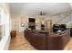 Expansive living room featuring hardwood floors, a stone fireplace, and an open layout for entertaining at 1056 Riverstone Dr, Social Circle, GA 30025