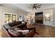Bright and airy living room featuring a stone fireplace and comfortable seating area at 1056 Riverstone Dr, Social Circle, GA 30025