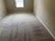 Bedroom with neutral walls, plush carpeting, and natural light coming from the window at 1266 Laurelwood Ct, Lawrenceville, GA 30045
