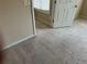Neutral bedroom featuring carpeted floors and light-colored walls at 1266 Laurelwood Ct, Lawrenceville, GA 30045