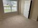 Bedroom with neutral carpet, a window with blinds, and a closet at 1266 Laurelwood Ct, Lawrenceville, GA 30045
