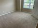 Bedroom with neutral carpet, a window with blinds at 1266 Laurelwood Ct, Lawrenceville, GA 30045