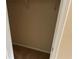 Empty closet featuring carpeted floors and shelving supports at 1266 Laurelwood Ct, Lawrenceville, GA 30045