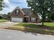 Charming brick home with a two-car garage and beautiful landscaping at 1266 Laurelwood Ct, Lawrenceville, GA 30045