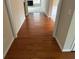 Spacious hallway features hardwood floors, neutral paint, and access to multiple rooms at 1266 Laurelwood Ct, Lawrenceville, GA 30045