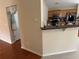 Cozy kitchen features wood cabinets, granite countertops, and a breakfast bar overlooking an adjacent area at 1266 Laurelwood Ct, Lawrenceville, GA 30045