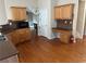 Kitchen with wooden cabinetry, desk space, stainless steel microwave and tile backsplash at 1266 Laurelwood Ct, Lawrenceville, GA 30045