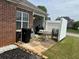 Small patio with brick accents and outdoor furniture arrangement at 1266 Laurelwood Ct, Lawrenceville, GA 30045