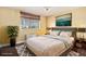 Cozy bedroom featuring a city view, large window, and stylish decor at 215 Piedmont Ne Ave # 507, Atlanta, GA 30308