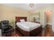 Well-lit bedroom featuring a mirrored closet and hardwood floors at 215 Piedmont Ne Ave # 507, Atlanta, GA 30308