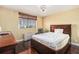 Comfortable bedroom with a city view window providing natural light and neutral decor at 215 Piedmont Ne Ave # 507, Atlanta, GA 30308
