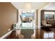 Elegant dining area with hardwood floors, modern light fixture, ample sunlight, and views of the city at 215 Piedmont Ne Ave # 507, Atlanta, GA 30308