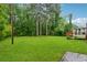Lush backyard features green grass and mature trees at 2255 Chippewa Dr, Riverdale, GA 30296