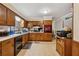 Kitchen area featuring tile flooring, wood cabinets and a double oven at 2255 Chippewa Dr, Riverdale, GA 30296