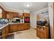 Side view of the kitchen area, showing the kitchen appliances and cabinets at 2255 Chippewa Dr, Riverdale, GA 30296