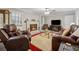 Inviting living room with a brick fireplace, comfortable seating, and contemporary accents at 2255 Chippewa Dr, Riverdale, GA 30296