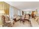 Comfortable living room with ample seating, bright windows, and a charming ambiance at 2255 Chippewa Dr, Riverdale, GA 30296