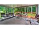 Bright sunroom with an outside view, lots of windows, and a table and chairs at 2255 Chippewa Dr, Riverdale, GA 30296