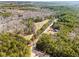 Aerial view of large property surrounded by trees at 500 Nolan Rd, Carrollton, GA 30116