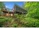 Exterior back view of home showing screened porch and deck at 500 Nolan Rd, Carrollton, GA 30116