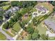 Aerial view of a luxurious home with circular driveway and a sprawling lawn at , Buford, GA 30518