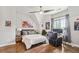 Cozy bedroom with decor, hardwood floors, and a large window at , Buford, GA 30518