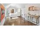 Bright bedroom with hardwood floors, white walls, and stylish decor at , Buford, GA 30518