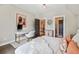Comfortable bedroom with a desk, neutral walls, hardwood floors and stylish decor at , Buford, GA 30518