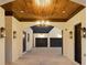 Exterior image of carport area showing wood ceiling and decorative outdoor lighting at , Buford, GA 30518