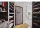 Spacious closet with custom shelving and hidden safe at , Buford, GA 30518