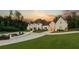 Luxury home exterior featuring a meticulously landscaped yard, modern architecture, and a circular driveway at , Buford, GA 30518