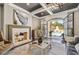 Cozy living room with fireplace and French doors leading to outdoor pool at , Buford, GA 30518
